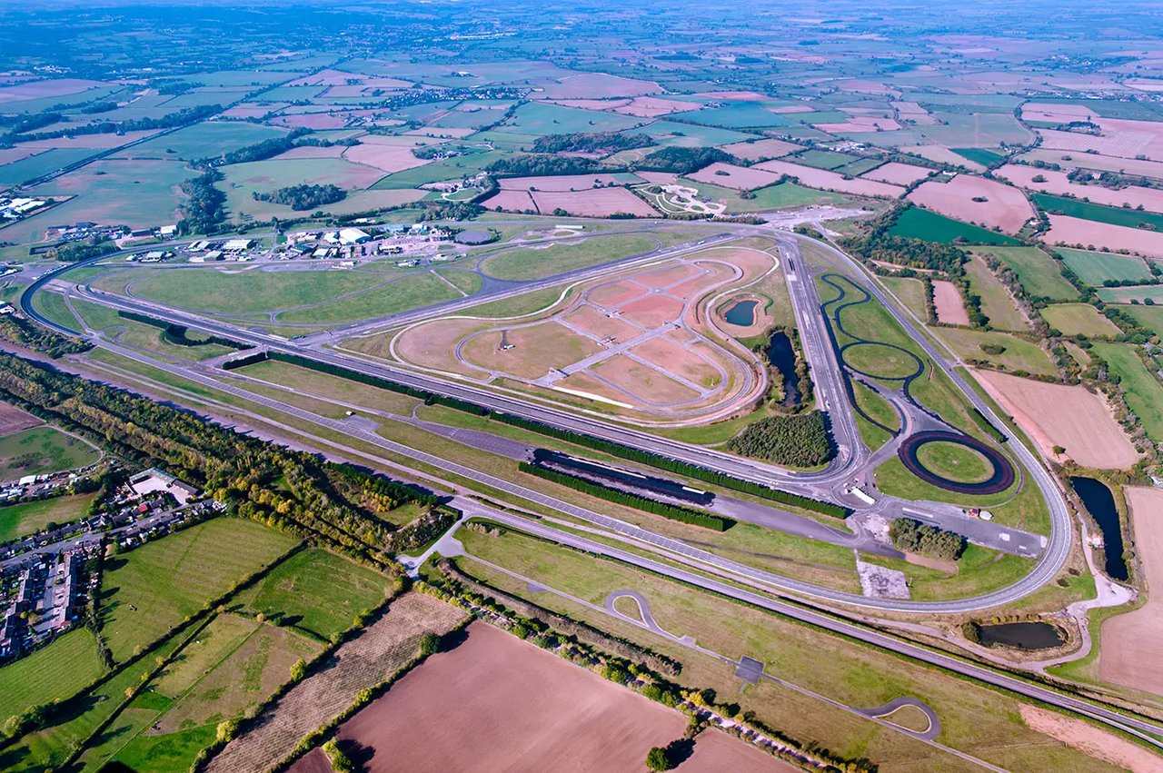 Illustrative reference image: an aerial view of a controlled-track environment
