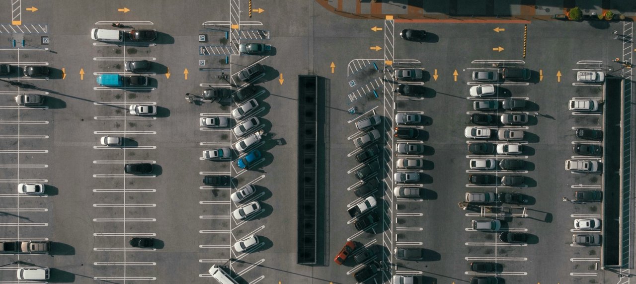 Illustrative reference image: parking spaces and vehicle layout viewed from above