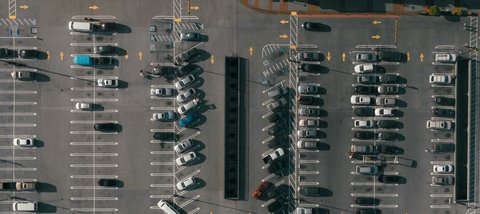 Illustrative reference image: parking spaces and vehicle layout viewed from above
