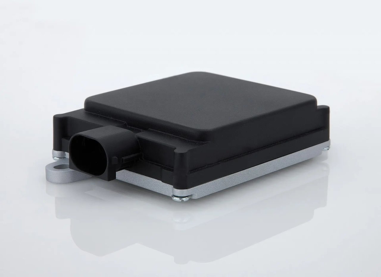 Illustrative reference image: an example automotive radar sensor enclosure