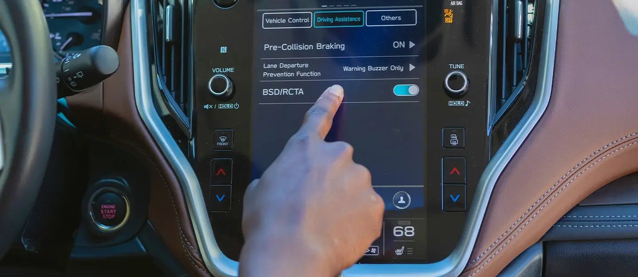 Illustrative reference image: vehicle feature settings on an in-cabin display
